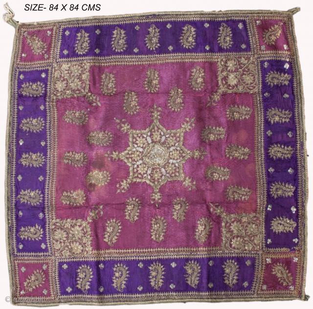 Zari Embroidery(Chauki Cover) - 
Beaten sheets of silver are drawn into strips and wires, wound round silk threads and set on a adda
or a frame when the craftsperson puts all his skill  ...