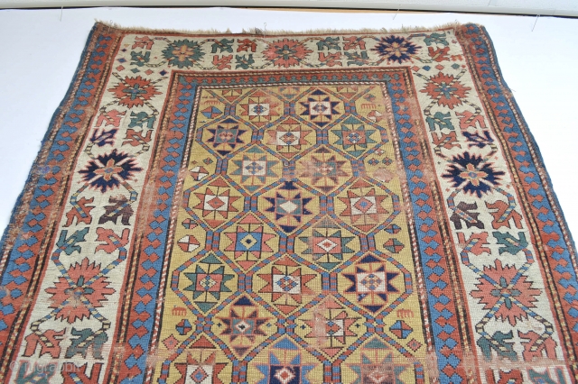 Beautiful Antique Caucasian rug 
All wonderful natural colours with bright yellow underground … pre 1850s worn and wear areas due his great age… ready to enjoy on your wall    