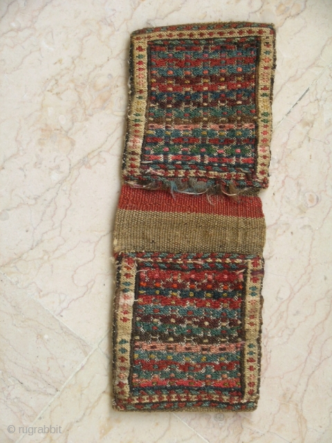 Persian Kurd Bag North West of Iran
size 33cmx13cm, circa 1920 all natural colors Sumack work over flat woven base.wool on wool base
just a narrow line been opened form one up side part.
 
