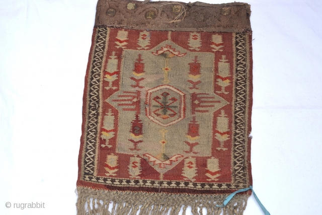 Dagistan kilim bag,nice leather  figure behind it early 20 century
size:28 x 34 cm
        14 x11 inches         