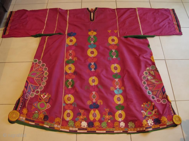 Silk Turkmen gown with mirror work.

A few small repairs

Purchased in Kabul in 2003                    