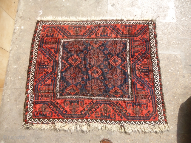 Baluch Rug fragment made a square bag face or Sitting Rug,early age,all natural colors,beautiful desigen.Size 3'3"*3ft.E.mail for more info and pics.            