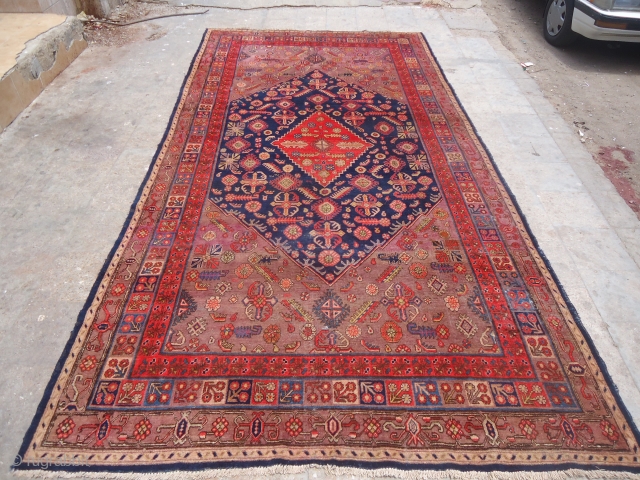 Khotan Rug with beautiful colors and desigen,very good condition without any repairs,Rare large size,very nice desigen,good age.Size 13'4"*6'10".E.mail for more info and pics.          