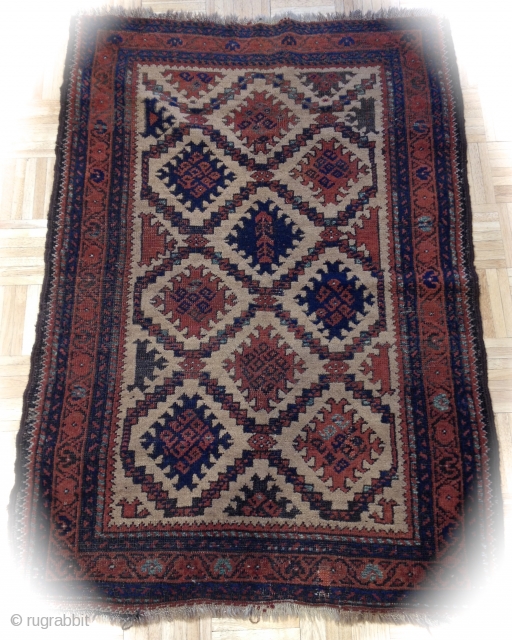 	A BALUCH ARAB Rug with a very pleasing design that is well drawn. Some end fraying, two 1" repair, brown corrosion. Please read my profile.        