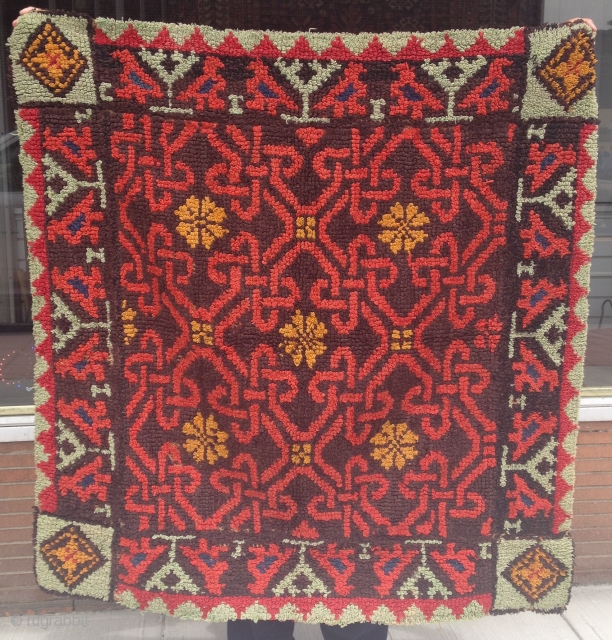 This looks like a bed covering that's been reduced to fit on a table. It's hand done and it has a very interesting weaving structure. It doesn't look like anything from Middle-east,  ...