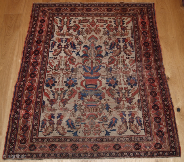 Antique Persian Afshar rug of 'vase' design on an ivory ground. www.knightsantiques.co.uk

2nd half 19th century.

Size: 5ft 0in x 4ft 6in. (153 x 137cm).

This is a scarce rug of very fine weave, the  ...