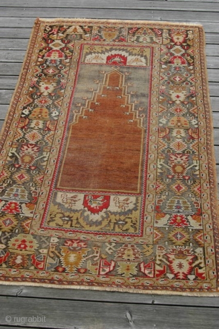 (15) Kirsehir prayer, late 19th c., 103 x 173 cm., with a whole flock of birds ready to spirit you to paradise. Well used by a devout follower, though foundation is complete,  ...