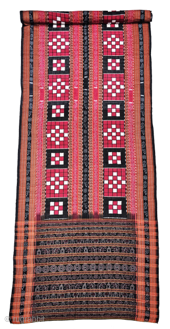 An Rare Cotton Dashphulia Saktapaar Domuha Saree From  West Odisha.

Plain weave with compound and double ikat, supplementary warp and continuous supplementary weft

20th Century 

120cm x 510cms

The checkerboard pattern in the field  ...