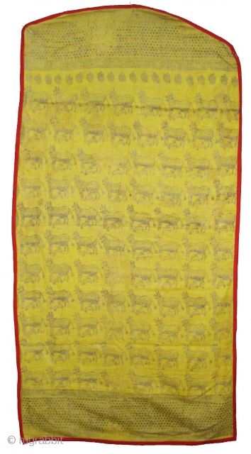 Pichwai for the Gopashtami From Gujarat India.Silver-tinsel Stamped with gum on yellow muslin cotton.Circa 1900.Its size is 82cmX100cm(DSC01463).               