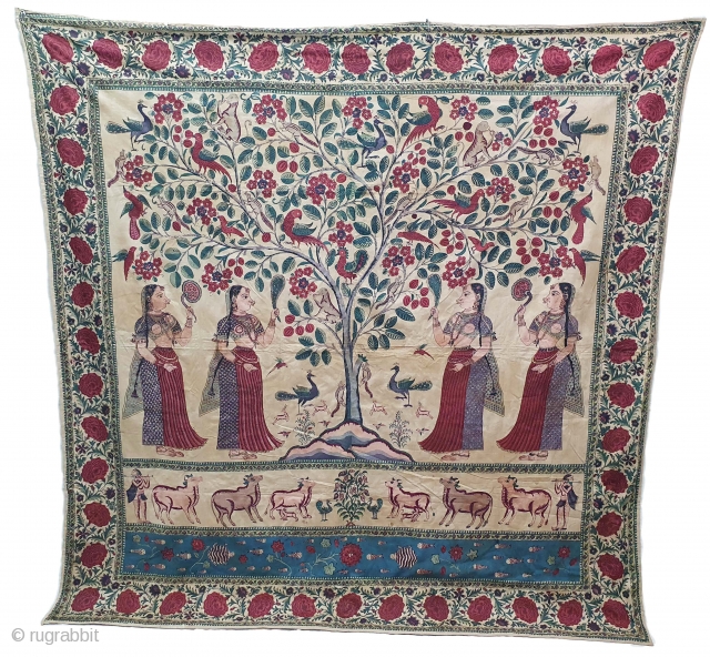 A Roller Print Pichwai depicting the Lord in the form of a tree with abundance and life.  It's flanked by Gopis on both sides venerating the  divine and the lower  ...