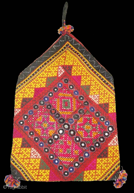 Dowry Bag(Bhujki),Mahar group,From Jaisalmer District of Rajasthan.India.Cotton embroidered with silk and cotton,mirrors,cotton tassels and string.H.30cm,W.20cm(DSC05959 New).                 