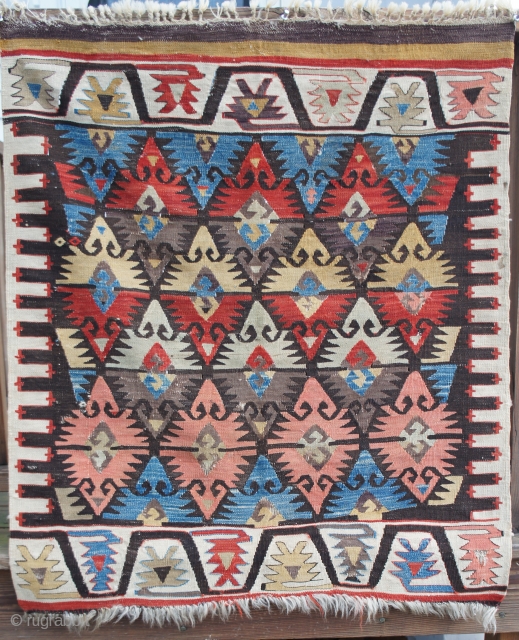 Mid 19th C. Turkish kilim, 32" x 37". All appropriate colors including a real aubergine that runs from clearer purple to a lighter grey-brown. Missing the center portion of two stripes at  ...