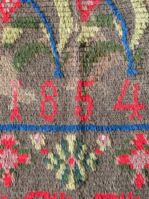 Small ryijy rug, probably from Åland, Finland, signed and dated AST 1854. It measures 134x93 cm. and has a few bright spots.           