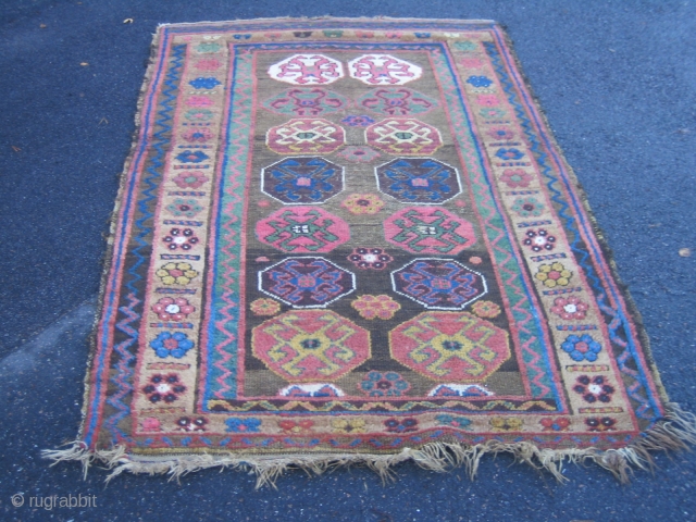 Old Kurdish all wool rug, 115x178 cm.
Great, shiny wool and some nice corrosion and wear.
Lovely green colour.
Two corners has lost some knots.
Rug has no repairs.        