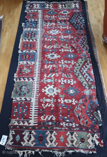 From Sonny Berntssons collection:
No 699 Antique Anatolian kilim, mounted on fabric.
All natural colours. 86 x 223 cm plus fabric.
 E-mails are not delivered to me due to a problem, please send a  ...