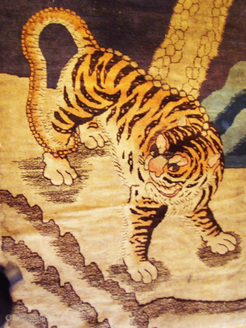 Early 20th century Baotou tiger rug. They are generally associated with tantric rituals whilst Chinese tiger rugs celebrate the fierceness and courage of the tiger as the protector against demons and evil  ...