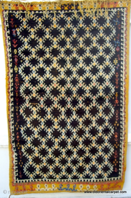 MOROCCAN HIGH ATLAS BERBER RUG. An old, rare and impeccable example from the region south of Tazenacht in the High Atlas. The wools are rich in lanolin and the knotting is extremely  ...