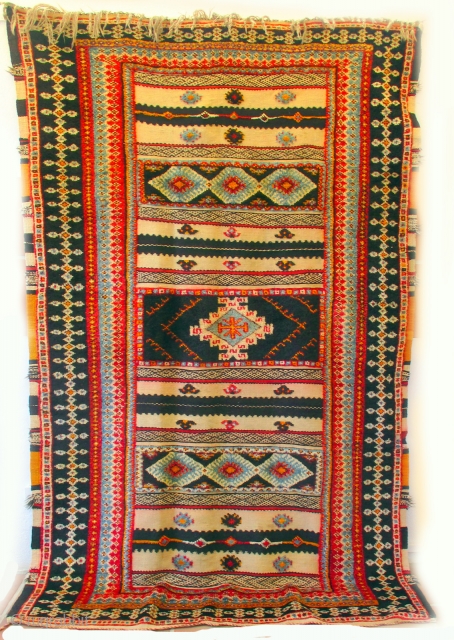 MOROCCAN BERBER MIXED TECHNIQUE RUG known as a handira. It is a mixture of piled woven sections and bands of embroidered kilim weave. This is a common mix for Berber rugs of  ...