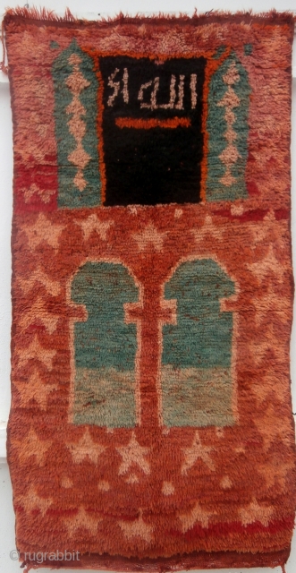 MOROCCAN BERBER INSCRIBED PRAYER RUG which is an extremely rare example from the Ait bou Ichaouen Berbers in the eastern High Atlas. I know of no other published similar rug. The attribution  ...