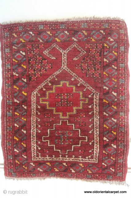 ERSARI TURKOMAN PRAYER RUG from the Beshir sub-tribe which originates from northern Afghanistan in the early 20th century. It has a wonderful pallette of natural colours with several shades of madder, undyed  ...