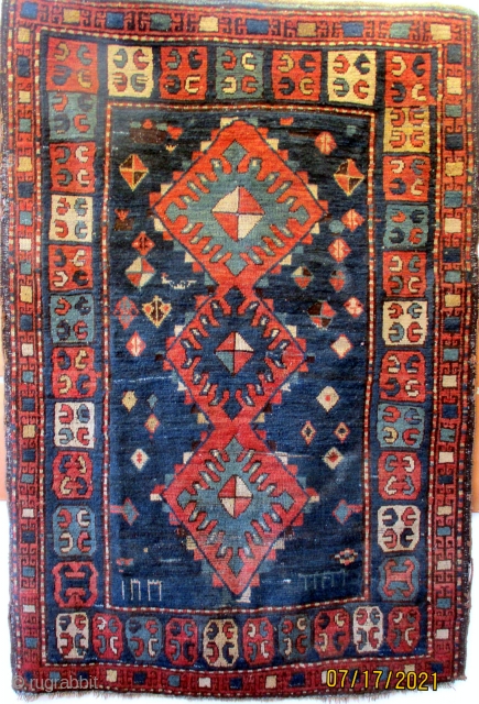 ANTIQUE PRE - SOVIET CAUCASIAN RUG from the region of Zakatal, a group of villages in north west Azerbaijan. The region is bordered to the north and east by Dagestan and to  ...