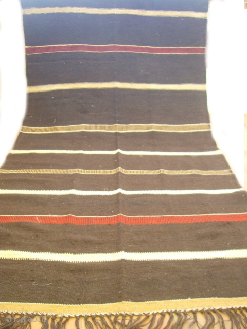 MOROCCAN BERBER HIGH ATLAS FLAT WEAVE / KILIM. A most unusual piece because, apart from one shade of madder red which is used in the design, the entire piece including the foundation  ...