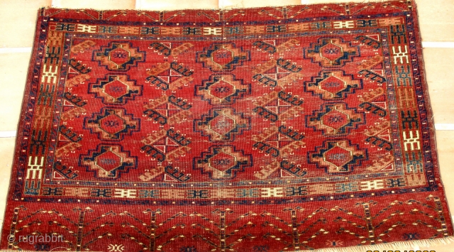 TURKOMAN YAMUT TENT BAG. A really unusual bag face with rich colours. The use of the "drynak" gul as the secondary design is rare. This is more usual to be found in  ...