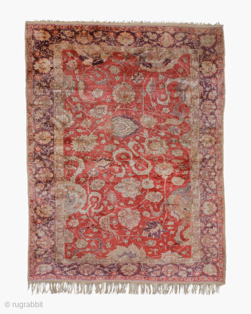 Hand knotted in Turkey between 1880-1890, this antique Kayseri Silk Rug enjoys a spacious but inviting toothed guard design, complemented by tasseled fringes highlighting the finesse of the inner pattern and its  ...