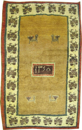 

 	

Gabbeh Nomad Persaian dated 1345=1927 Semi antique, collector's item. 196 x 120 (cm) 6' 5" x 3' 11"  carpet ID: T-695
The knots are hand spun wool, the warp and the  ...