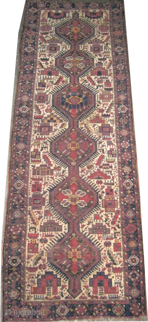  	
Shiraz Persian runner circa 1915 antique, Size: 269 x 92 (cm) 8' 10" x 3'  carpet ID: K-2271
The background color is ivory, six medallions surrounded with animals, geometric design, certain  ...