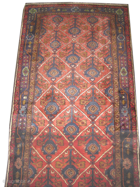 
Nahavan Persian, knotted circa 1935, 105 x 270 cm, ID: K-2236
The knots are hand spun silky wool, the background color is rust, the surrounded large border is blue, allover geometric design, thick  ...