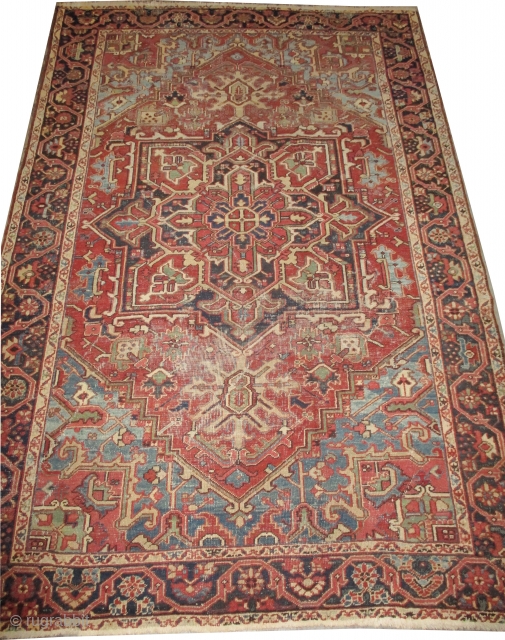 Heriz Persian knotted circa in 1915 antique, 304 x 206 
 carpet ID: P-5244
The black knots are oxidized, the knots are hand spun wool, the background color is terracotta, the center medallion  ...
