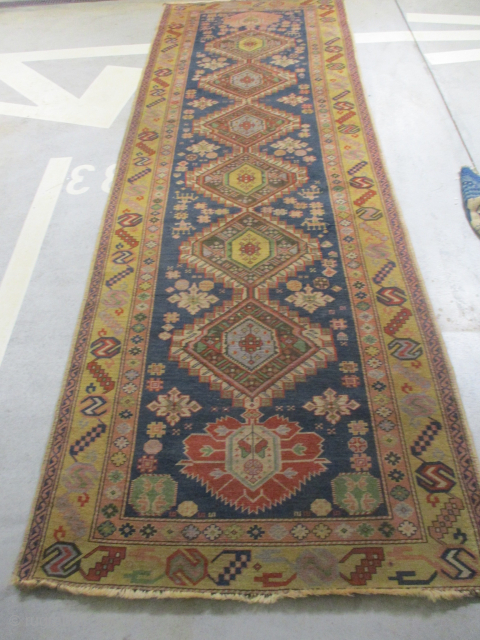 Shirvan, knotted circa 1935, 138 x 411 cm, ID: KZM-5
Blue background, 8 medallions, yellow border. The knots, the warp and the weft threads are hand spun wool. The pile is uniformly short,  ...