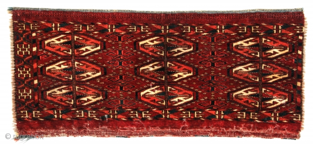 Rare gols on this choice, early Tekke kap with well-executed secondary and tertiary patterns. Early border, the right one of which is missing, selvages missing, 21 5/8 x 10 inches (55 X  ...