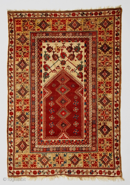 Classic early 19c Anatolian Milas prayer rug with amazing wool, refined drawing and harmonious palette including a luscious aubergine.              