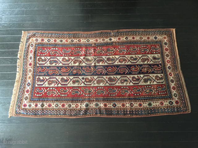 Origin and description: Carpet of Caucasian origin, taking in traditional stylized motifs the "boteh" in the central field and a chain of stars in the main border. The "boteh" evokes by its  ...