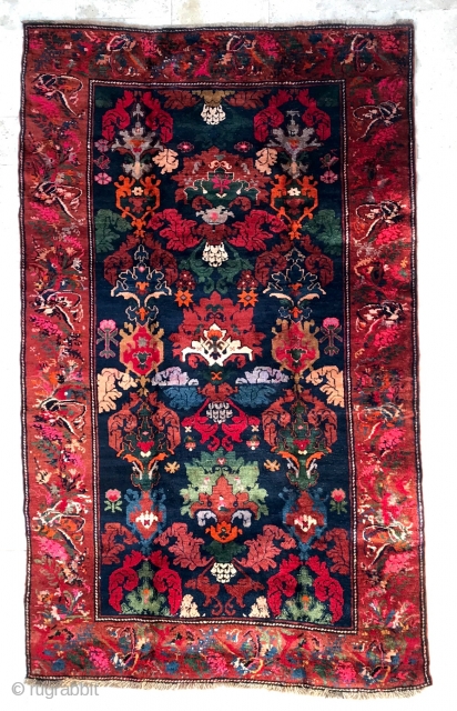 Description: magnificent Karabagh carpet. Blue background, stylized flower decoration and characters. Brick red border of knotted flower wreaths.

Dimensions: 275 cm x 166 cm

Age: early 20th century

Condition: perfect, full and regular pile
  