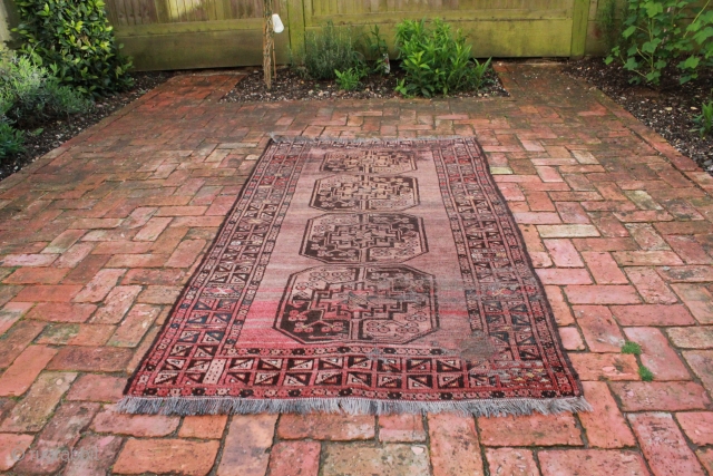 This is an Afghan rug with elephant feet decoration.  This type of rug is sometimes referred to as 'Afghan Gold'.
Circa the last quarter of the 19th century.  The rug shows  ...