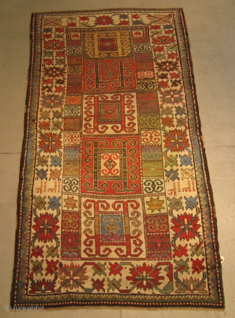 A Kazak Rug, 7' 11" x 3' 10", in fine condition, dated 1312AH/1894AD, with a dramatic "crab" border.               