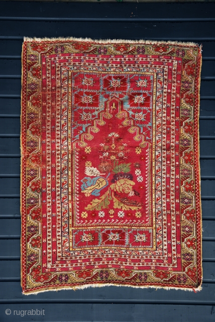 Early Anatolian prayer rug with brilliant colors and in reasonable condition for the age . Circa early to mid 19th century. Probably Kirsehir, but with Gördes elements.      