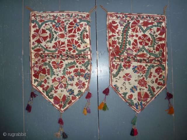 Beautiful antique suzani fragments made into a pair of ok bash like decorations, 58 x 35 cm, 23 x 14 inch            