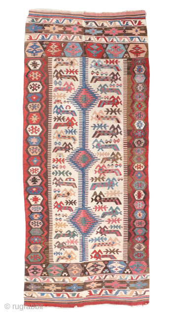 Central Anatolian Kilim, Turkey, Early 19th C., 4'7'' x 11'2'' (140 x 340 cm). Weight: 11 lbs. Material: wool surface, wool warp. Rare example of a single-headed zoomorphic figure (only three published  ...