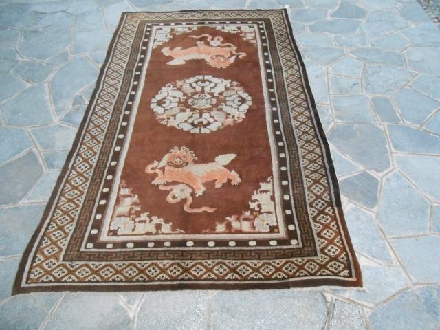 264 x 161  cm is the size of this antique Gansu chinese carpet knotted around the first quarter of XXth century. Good condition and washed. Original design with 2 Fo dogs,  ...