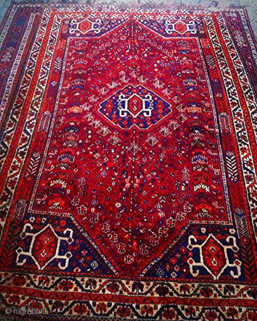 This is a quite old Qashqai rug (also known as Shiraz). It comes in 260 * 164 cm. Shiny natural dyes and excellent condition except for some damages by moth on the  ...