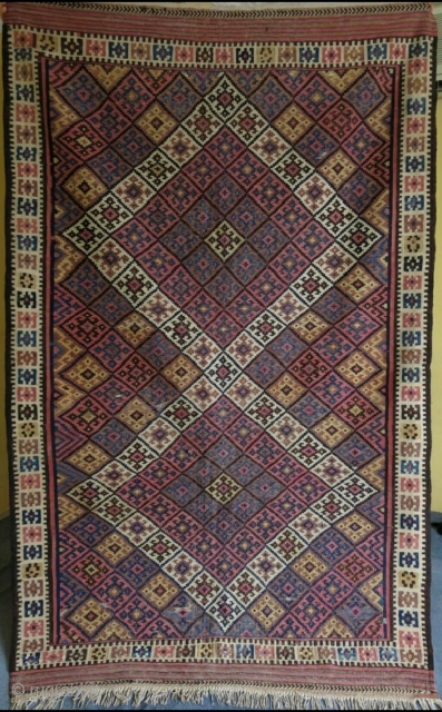 Fine Kurdish kilim. Wool on cotton.
Size:  147 cm x 231 cm (58” x 91”).
                  