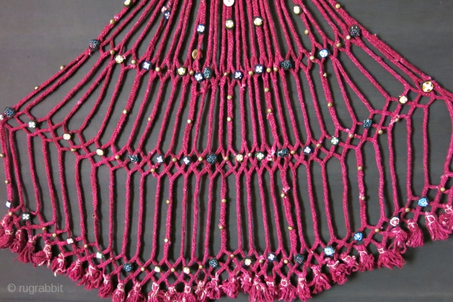 Afghanistan Pashtun tribal wool braided talismanic hanging. Upper part is like small bag where something can be put in the net part. Beaded rosette / handmade button like decorations with metal buttons  ...