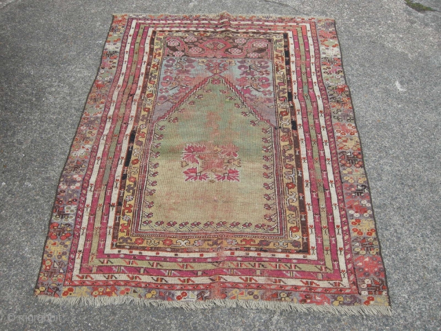 Antique Turkish prayer rug green ground, 145x 115 cm,
damage and old repairs, good colours .                  