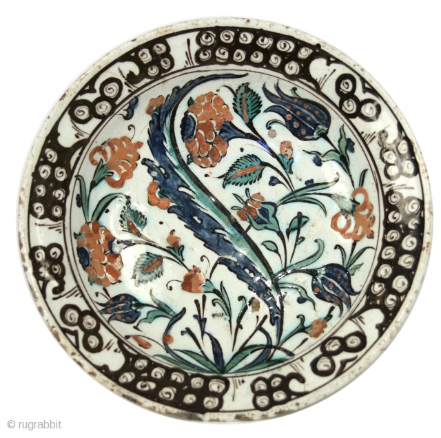 Iznik Plate; Ottoman Empire; Circa 1600; 10'' in diameter;  A detailed article on these magnificent pieces of art can be found here: https://www.christies.com/features/Iznik-Pottery-Collecting-Guide-7183-1.aspx         