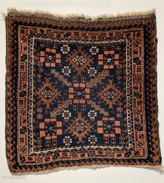 Unusual center medallion - Baluch Bag Face, woven in N.E Persia, circa 1870, measuring 2’ 2” x 2’ 2”.              