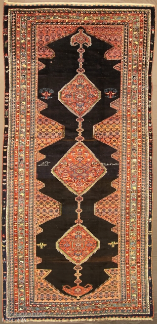 Antique Persian Kurdo Carpet, ca. 1920,

410 × 185 cm (13' 5" × 6' 0"),

Sign/Firma: Knoted by Taji Year 1318 AH ....... (Amal Taji, Sane 1318.....)        